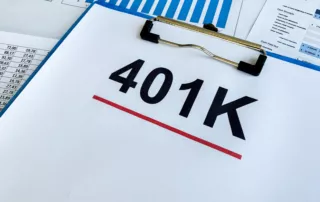 Clipboard showing bold “401K” text underlined in red over financial documents and a bar graph — symbolizing retirement-account protection, pension concerns, and financial planning under bankruptcy law.