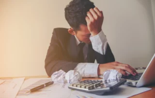 Stressed sole proprietor overwhelmed by business debt, considering bankruptcy options.